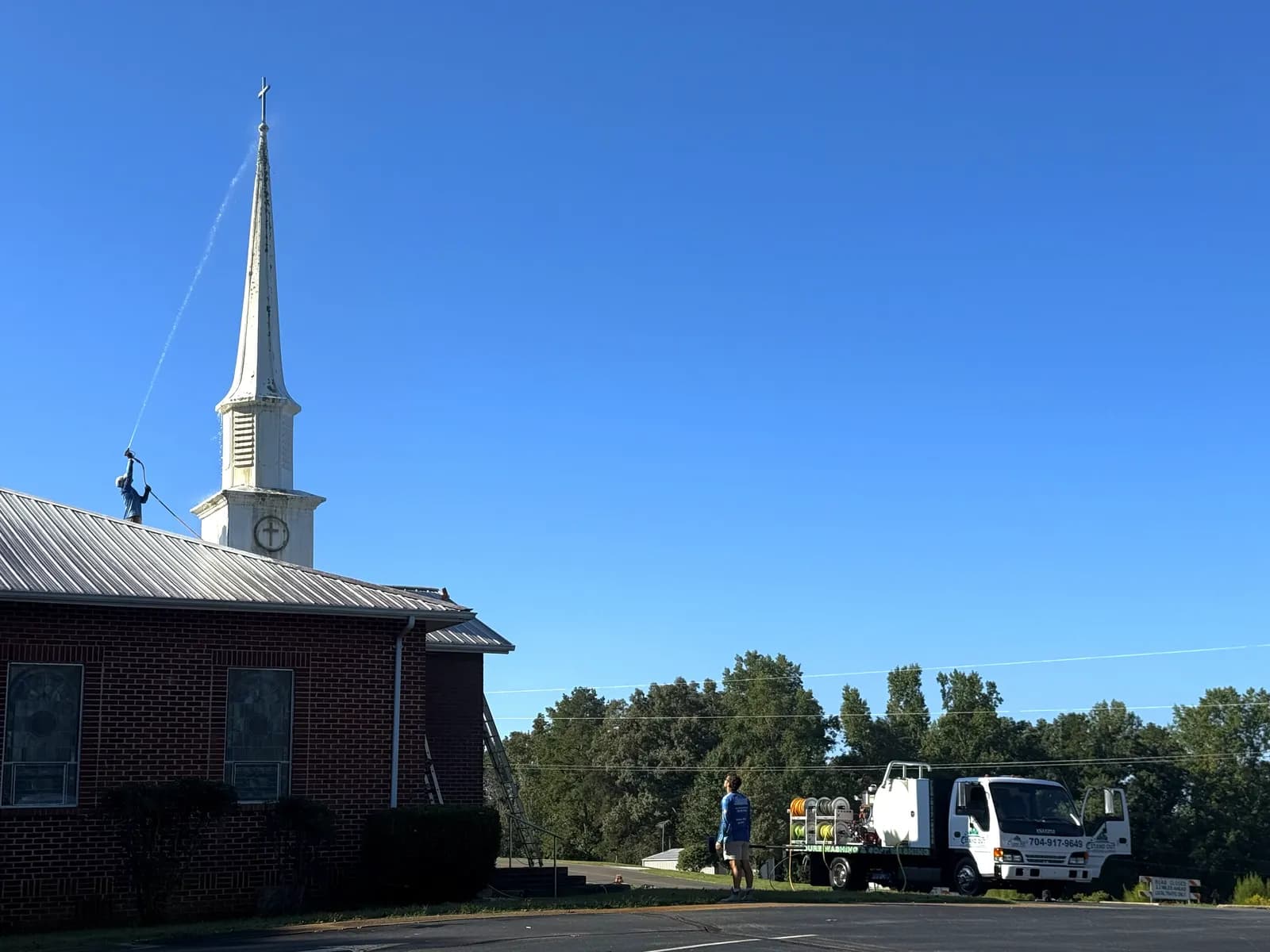 Stand Out Exterior Cleaning washing a church steeple in Denver NC