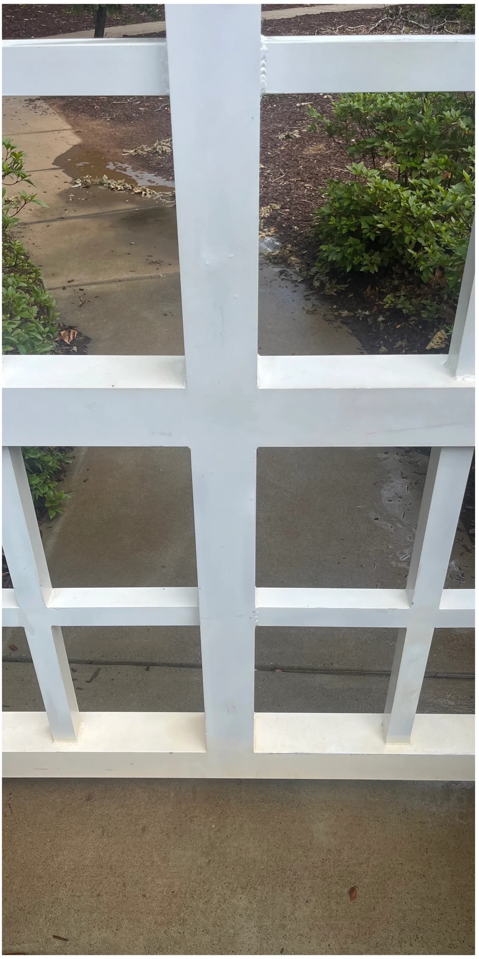 Brightened white fence after Stand Out Exterior fence washing in Denver NC